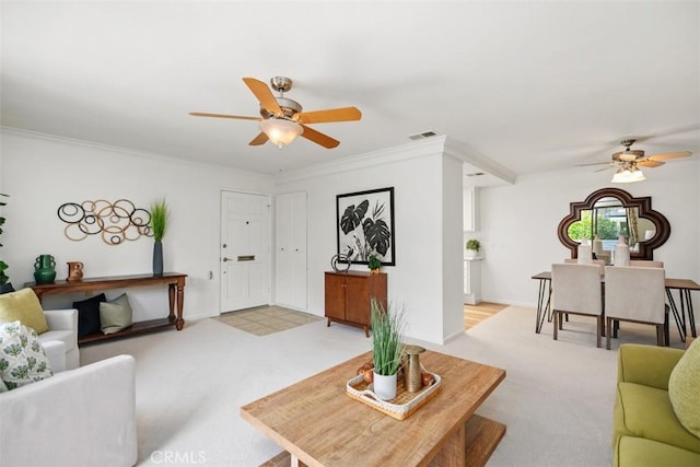 933 Avenida Majorca Unit P, Laguna Woods, CA 92637 - living area with a ceiling fan, light colored carpet, and crown molding