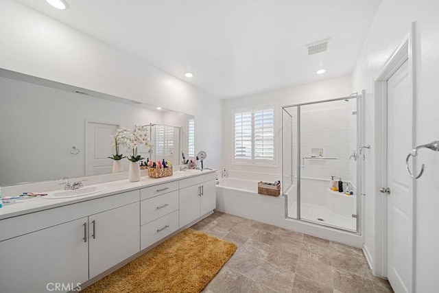 30701 Noble Ct, Homeland, CA 92548 - bathroom featuring double vanity, a stall shower, a garden tub, and recessed lighting