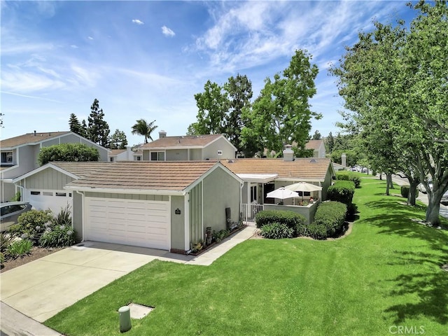 33081 Regatta Ct, San Juan Capistrano, CA 92675 - view of front of house with stucco siding, a tiled roof, a front yard, a garage, and driveway