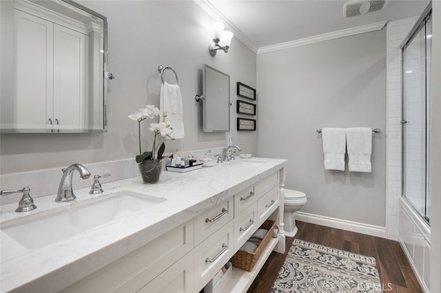 21761 Tahoe Ln, Lake Forest, CA 92630 - full bathroom with ornamental molding, double vanity, wood finished floors, and bath / shower combo with glass door