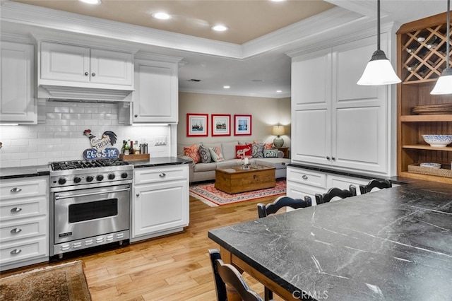 21761 Tahoe Ln, Lake Forest, CA 92630 - kitchen with designer range, light wood-style floors, white cabinetry, ornamental molding, and decorative backsplash