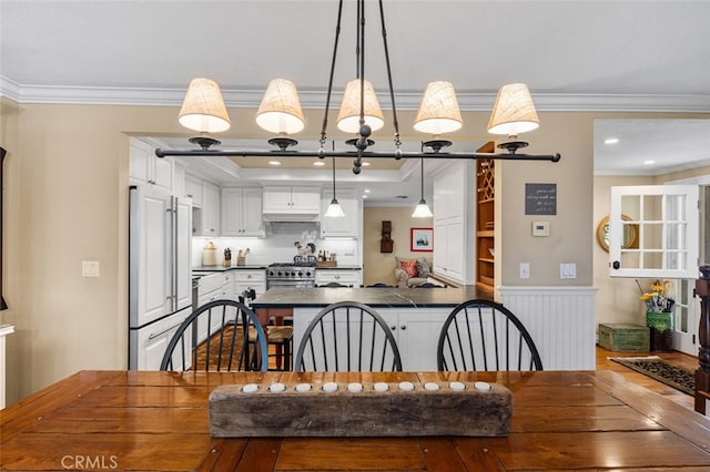 21761 Tahoe Ln, Lake Forest, CA 92630 - dining area featuring crown molding, a wainscoted wall, and wood finished floors