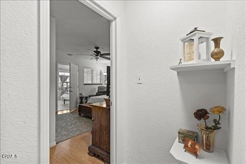 22820 Mariposa Rd, Tehachapi, CA 93561 - hallway featuring a textured wall and wood finished floors