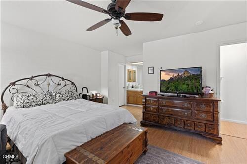 22820 Mariposa Rd, Tehachapi, CA 93561 - bedroom with wood finished floors, ensuite bathroom, and ceiling fan
