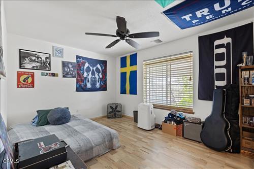 22820 Mariposa Rd, Tehachapi, CA 93561 - bedroom with wood finished floors and a ceiling fan