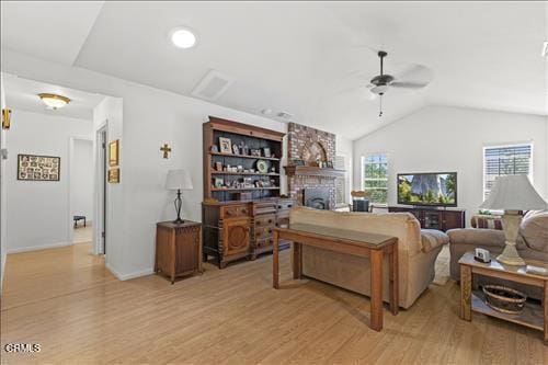 22820 Mariposa Rd, Tehachapi, CA 93561 - living room featuring ceiling fan, light wood-style floors, vaulted ceiling, and a brick fireplace