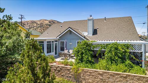 22820 Mariposa Rd, Tehachapi, CA 93561 - back of property with a patio and a chimney