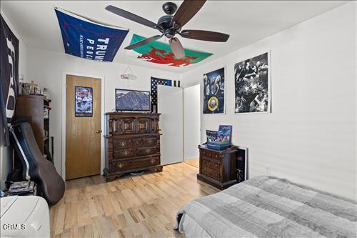 22820 Mariposa Rd, Tehachapi, CA 93561 - bedroom featuring wood finished floors and a ceiling fan