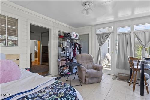 22820 Mariposa Rd, Tehachapi, CA 93561 - tiled bedroom featuring multiple windows, access to exterior, and a closet