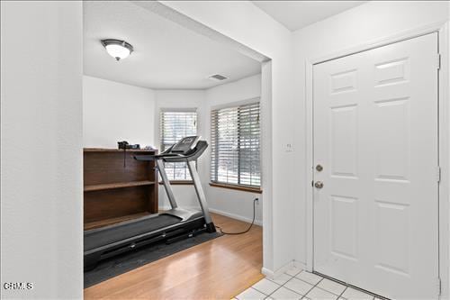 22820 Mariposa Rd, Tehachapi, CA 93561 - exercise room featuring baseboards and light wood finished floors