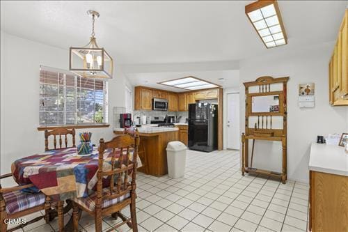 22820 Mariposa Rd, Tehachapi, CA 93561 - dining area with a chandelier and light tile patterned floors