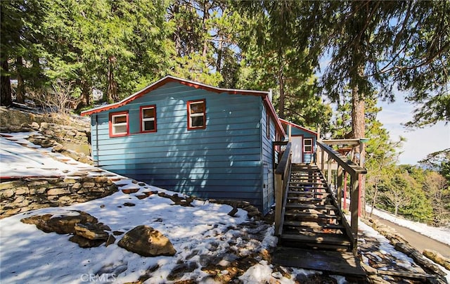 22052 Elliot Rd, Cedarpines Park, CA 92322 - view of property exterior featuring stairway