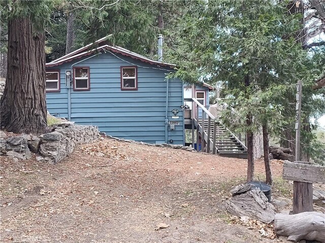 22052 Elliot Rd, Cedarpines Park, CA 92322 - view of side of home with stairway