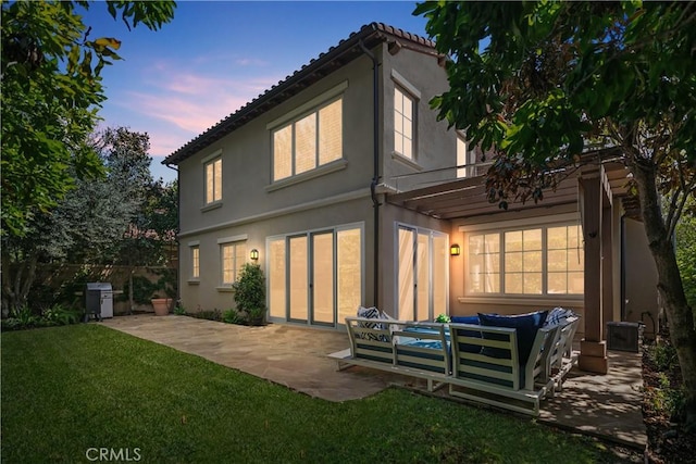 32 Tesoro, Irvine, CA 92618 - rear view of house featuring a patio, an outdoor hangout area, and stucco siding
