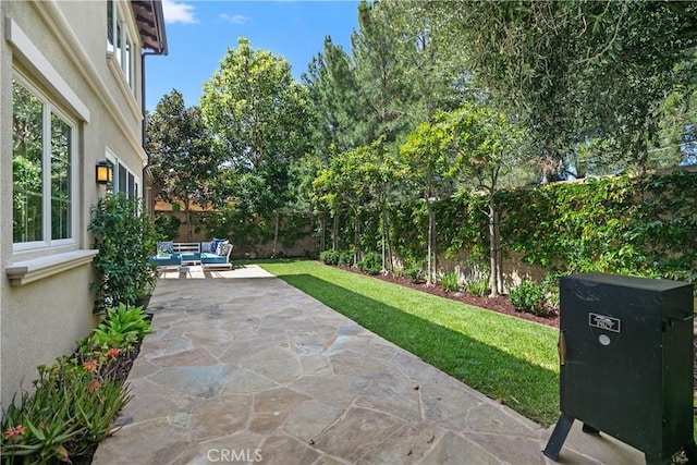 32 Tesoro, Irvine, CA 92618 - fenced backyard with an outdoor hangout area and a patio area