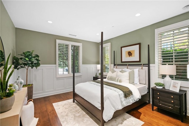 32 Tesoro, Irvine, CA 92618 - bedroom featuring wood-type flooring, a wainscoted wall, a decorative wall, and recessed lighting