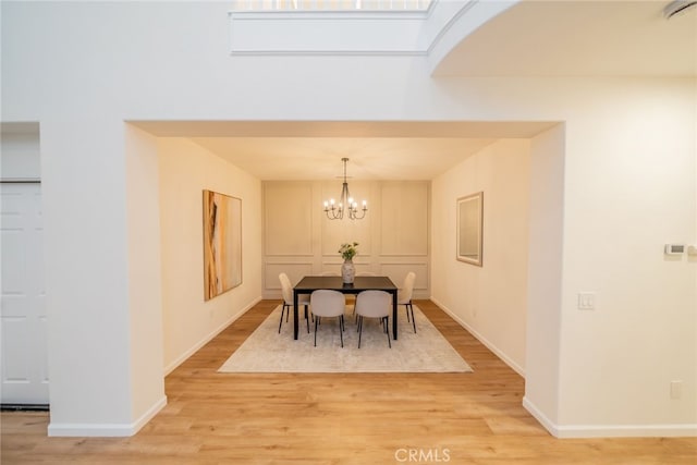 2455 Mcmackin Dr, Corona, CA 92881 - dining area featuring light wood-style floors and a chandelier
