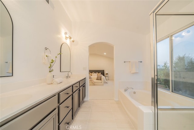 2455 Mcmackin Dr, Corona, CA 92881 - bathroom featuring a bath, double vanity, tile patterned floors, and ensuite bathroom