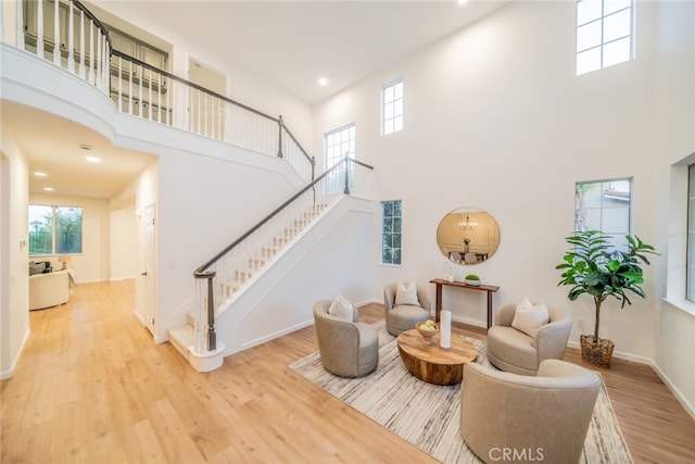 2455 Mcmackin Dr, Corona, CA 92881 - living area with a high ceiling, wood finished floors, plenty of natural light, stairway, and recessed lighting
