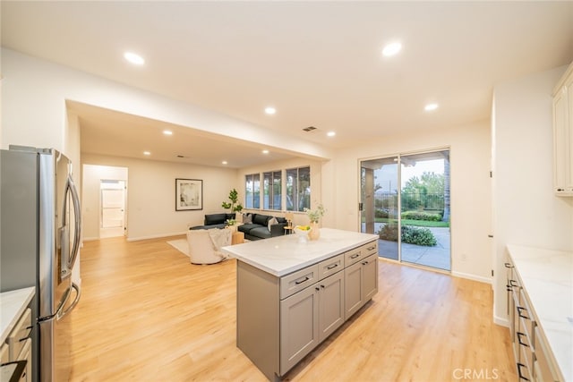 2455 Mcmackin Dr, Corona, CA 92881 - kitchen featuring gray cabinets, stainless steel fridge, light wood finished floors, a center island, and recessed lighting