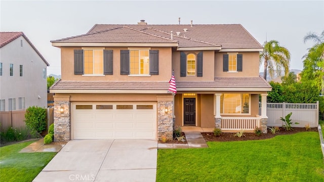 2455 Mcmackin Dr, Corona, CA 92881 - view of front of property with a garage, a porch, concrete driveway, stucco siding, and stone siding