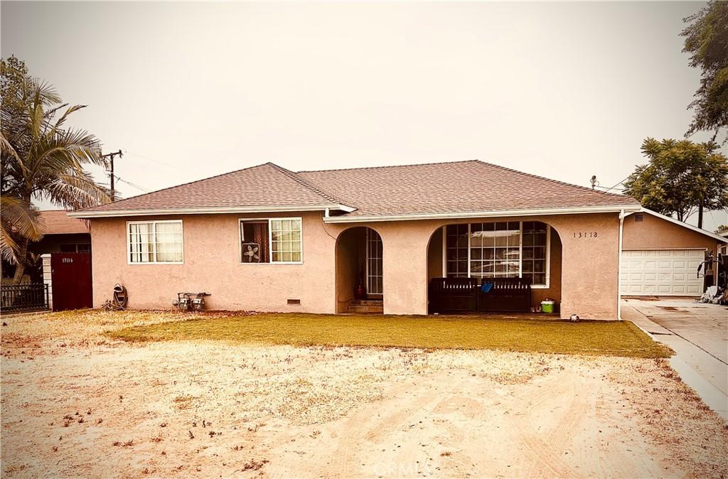 13118 Beaty Ave, Whittier, CA 90605 - view of front of home featuring covered porch, stucco siding, driveway, and an attached garage