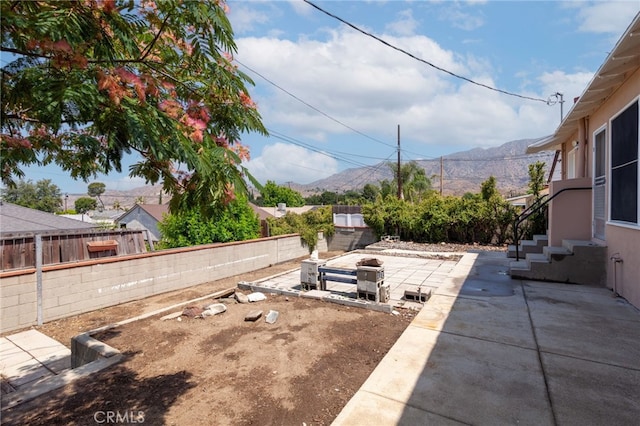 10935 Nassau Ave, Sunland, CA 91040 - fenced backyard with a patio, entry steps, and a mountain view