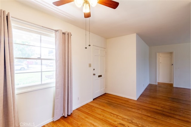 10935 Nassau Ave, Sunland, CA 91040 - empty room with healthy amount of natural light, a ceiling fan, and light wood-style flooring