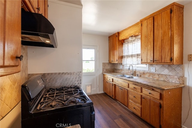 10935 Nassau Ave, Sunland, CA 91040 - kitchen featuring black gas range oven, range hood, dark wood finished floors, backsplash, and light countertops
