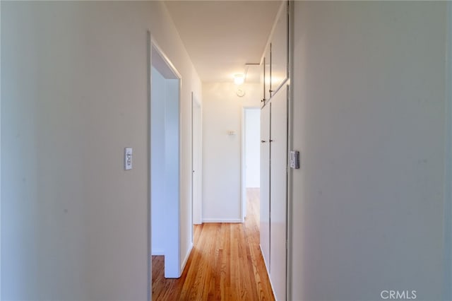 10935 Nassau Ave, Sunland, CA 91040 - hallway with light wood-style floors and baseboards