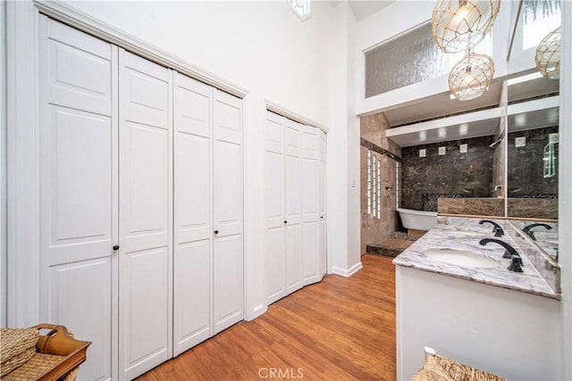 1733 Bayou Way, Seal Beach, CA 90740 - full bath featuring a closet, wood finished floors, double vanity, and a shower