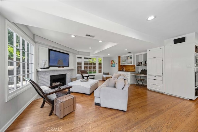 1733 Bayou Way, Seal Beach, CA 90740 - living room with light wood-style flooring, plenty of natural light, a raised ceiling, and recessed lighting