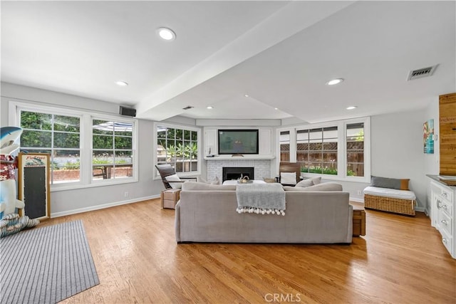 1733 Bayou Way, Seal Beach, CA 90740 - living area featuring a fireplace, light wood-style floors, and recessed lighting