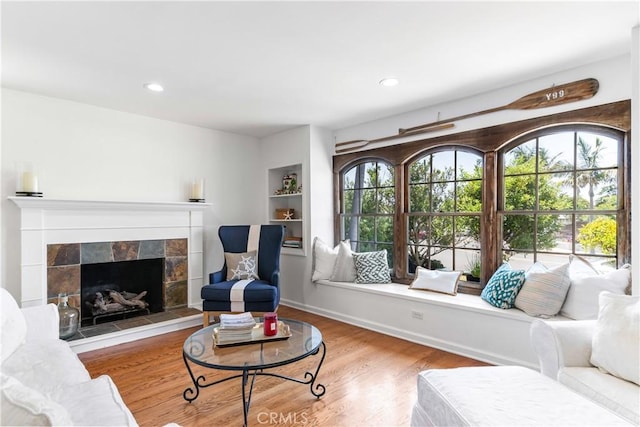 1733 Bayou Way, Seal Beach, CA 90740 - living room featuring a fireplace, wood finished floors, and recessed lighting