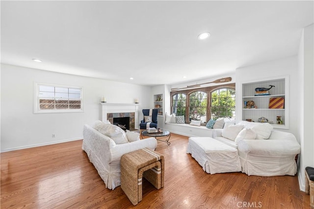 1733 Bayou Way, Seal Beach, CA 90740 - living area with a tile fireplace, wood finished floors, and recessed lighting