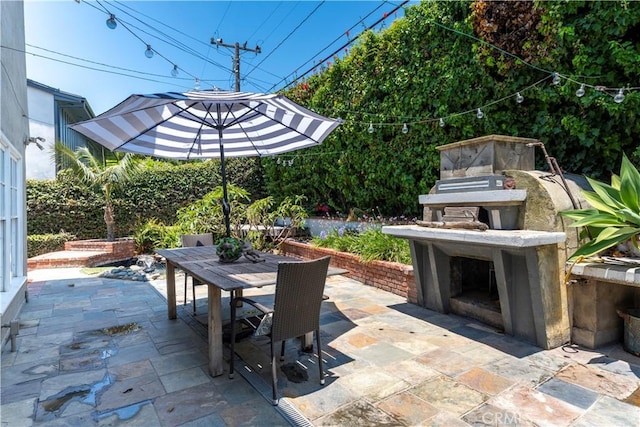 1733 Bayou Way, Seal Beach, CA 90740 - view of patio / terrace featuring outdoor dining space and exterior fireplace