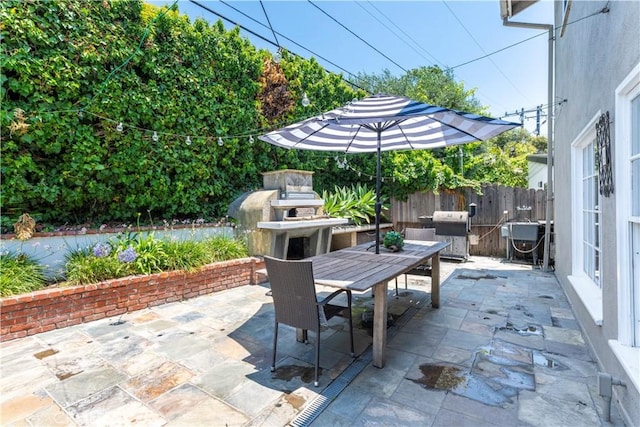 1733 Bayou Way, Seal Beach, CA 90740 - view of patio featuring outdoor dining area, an outdoor fireplace, and area for grilling