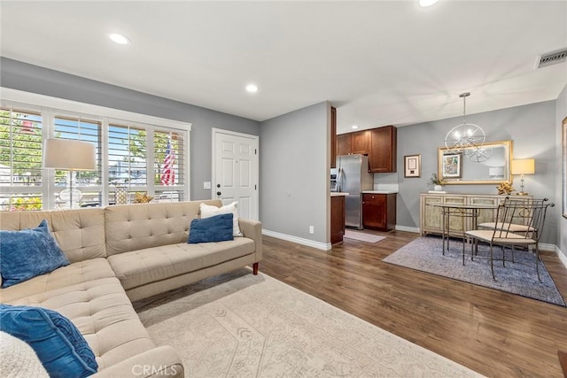 199 N Magnolia Ave Unit D, Anaheim, CA 92801 - living room featuring dark wood finished floors, a chandelier, and recessed lighting