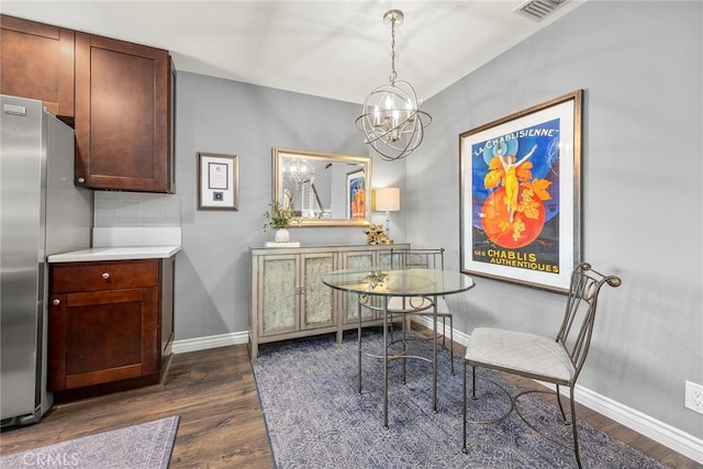 199 N Magnolia Ave Unit D, Anaheim, CA 92801 - dining space with dark wood-style flooring and a chandelier