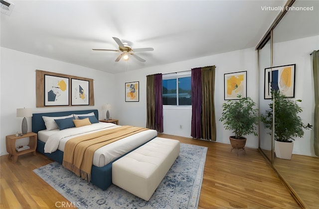 5064 N Berkeley Ave, San Bernardino, CA 92407 - bedroom with light wood-type flooring and a ceiling fan