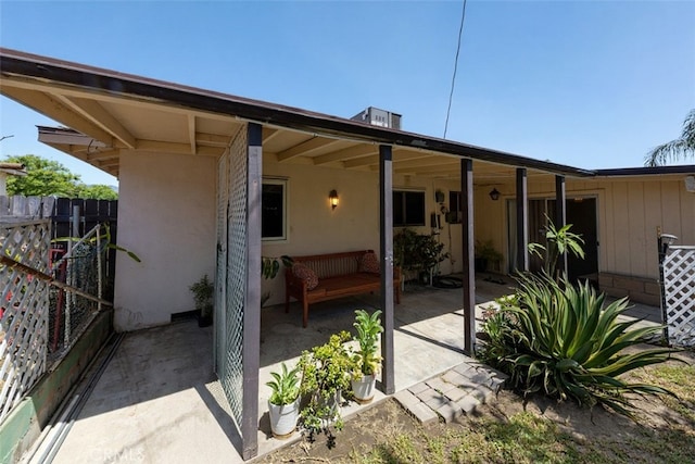 5064 N Berkeley Ave, San Bernardino, CA 92407 - rear view of property with stucco siding and a patio