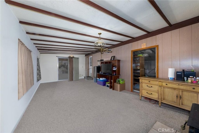5064 N Berkeley Ave, San Bernardino, CA 92407 - living room featuring beam ceiling, carpet, and wooden walls