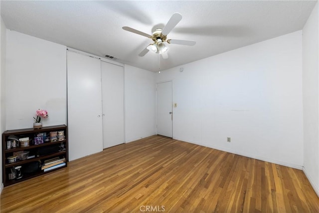 5064 N Berkeley Ave, San Bernardino, CA 92407 - unfurnished bedroom with light wood-style floors, a closet, and a ceiling fan