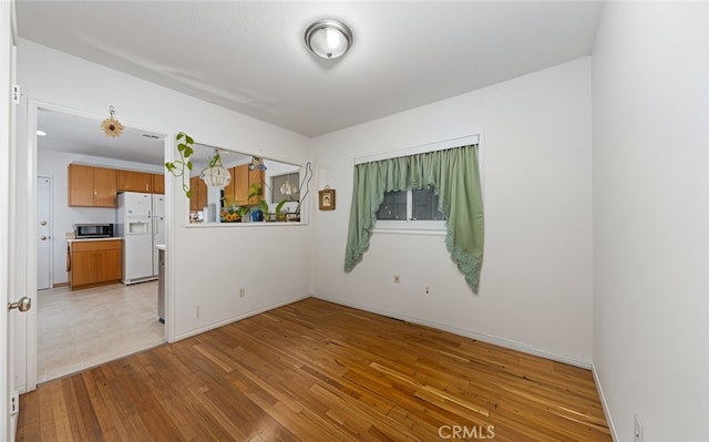 5064 N Berkeley Ave, San Bernardino, CA 92407 - empty room featuring light wood-style flooring and baseboards