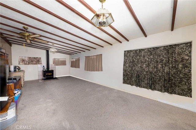 5064 N Berkeley Ave, San Bernardino, CA 92407 - unfurnished living room featuring a wood stove, carpet flooring, and ceiling fan
