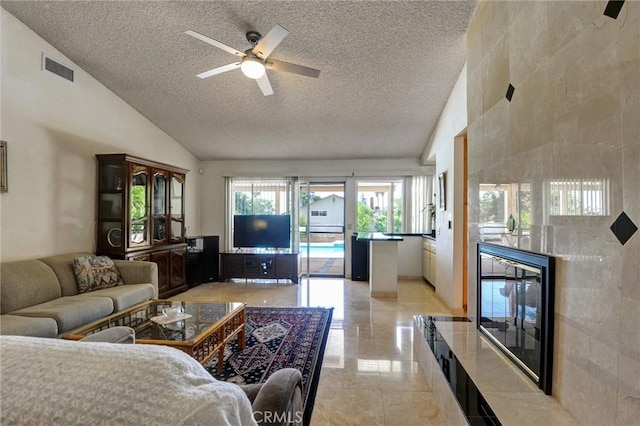 872 Deborah St, Upland, CA 91784 - living room with a textured ceiling, vaulted ceiling, ceiling fan, and beverage cooler