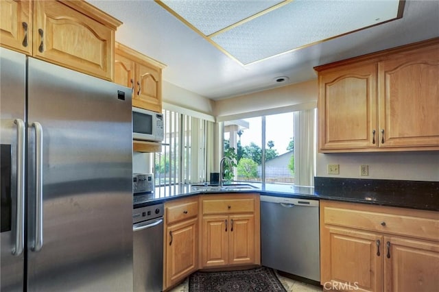 872 Deborah St, Upland, CA 91784 - kitchen featuring stainless steel appliances, dark stone countertops, and light tile patterned floors