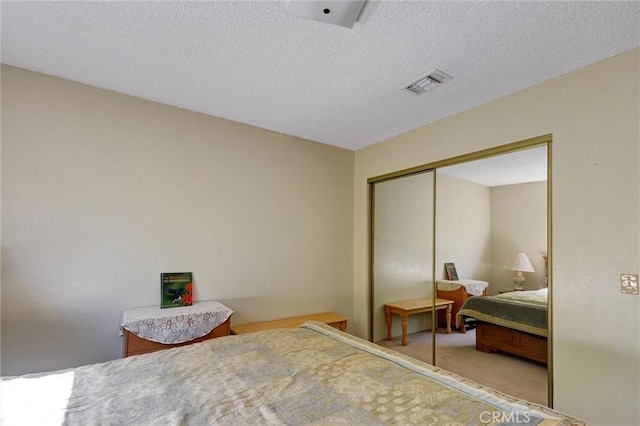 872 Deborah St, Upland, CA 91784 - bedroom featuring a closet, light colored carpet, and a textured ceiling
