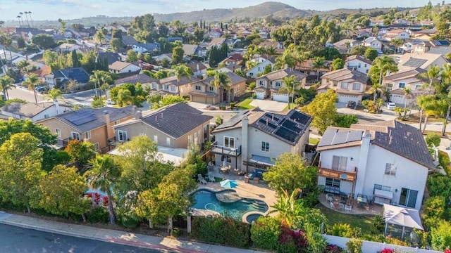 9141 Meadowrun Ct, San Diego, CA 92129 - aerial perspective of suburban area with mountains and a pool area