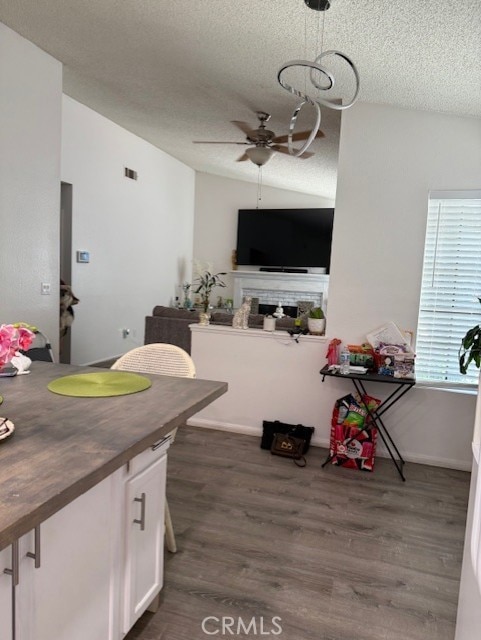 12446 Mount Baldy Dr, Victorville, CA 92392 - dining area featuring ceiling fan, a textured ceiling, and dark wood-style floors